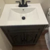 Modern bathroom sink with faucet, installed in a residential bathroom.